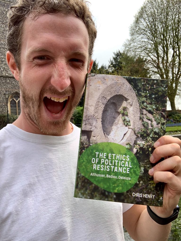 Chris Henry holding The Ethics of Political Resistance